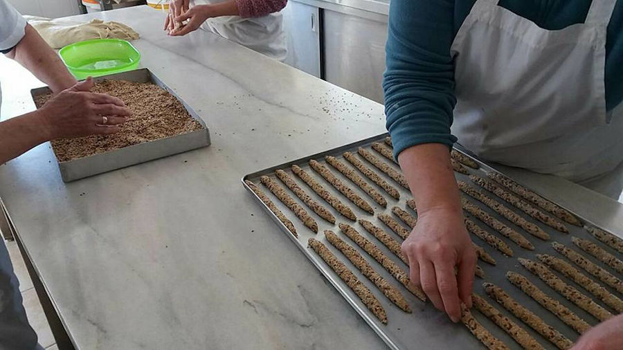 women making sesame seed breadsticks at The Apolloniatisses workshop